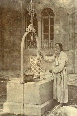 Fr. Parthenius by one of his wells.