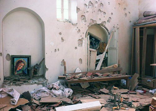 A church in the Syrian village of al-Duwayr, after an attack by Islamist militiamen. (Image credit: Syria Report)
