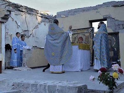 Orthodox Christians of Donbass praying on ruins of their churches