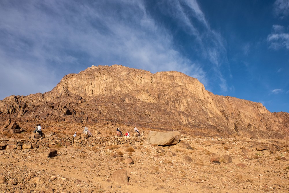 Pilgrims climbing the mountain at daytime