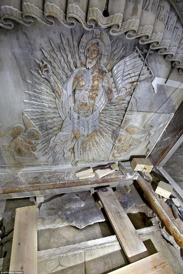 An ornate marble carving of Jesus Christ decorates the tomb where his body is believed to have been laid