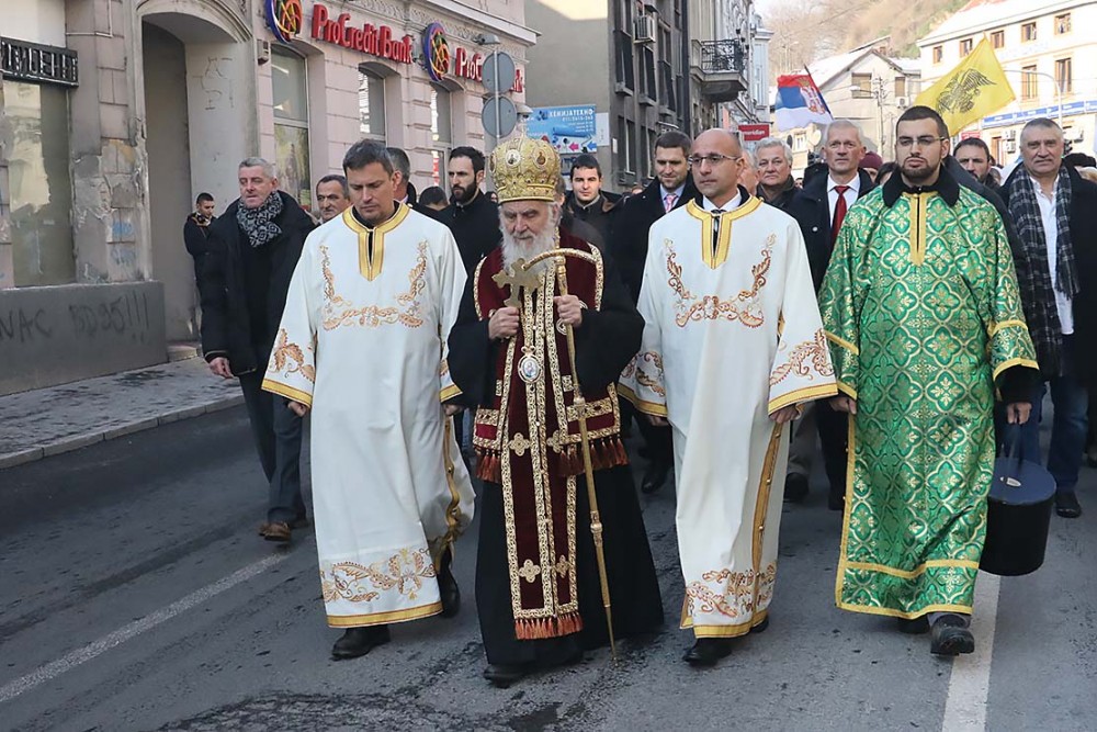 Patriarch Irenej leads the Theophany procession through the streets of Belgrad.