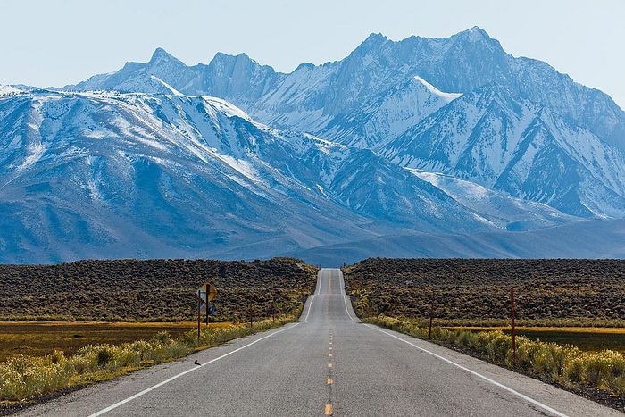 A road amidst the majestic Sierra Nevada Mountains.