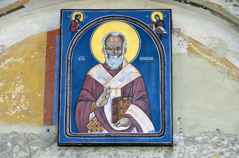 An icon of St. Nicholas the Wonderworker above the church entrance.