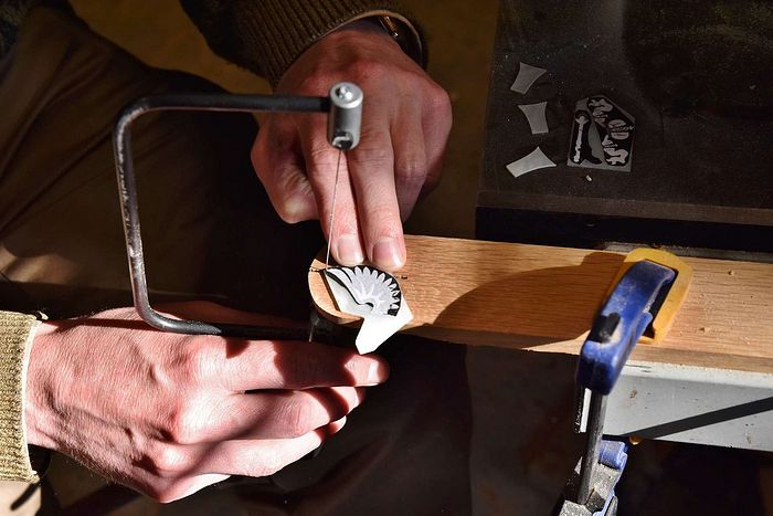 The author cutting out the mother-of-pearl Russian Imperial Eagle with a jeweler’s saw