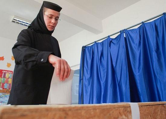 An Orthodox nun casting her ballot in Giurgiu, southern Romania. Photo: Octav Ganea/Inquam Photos