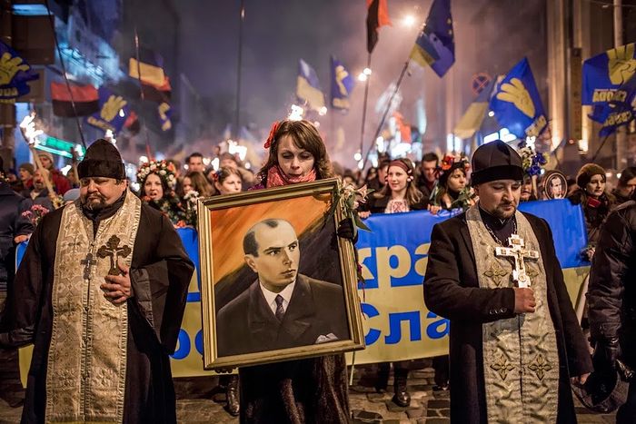 Uniates marching with Nazi war criminal portrait of Bandera