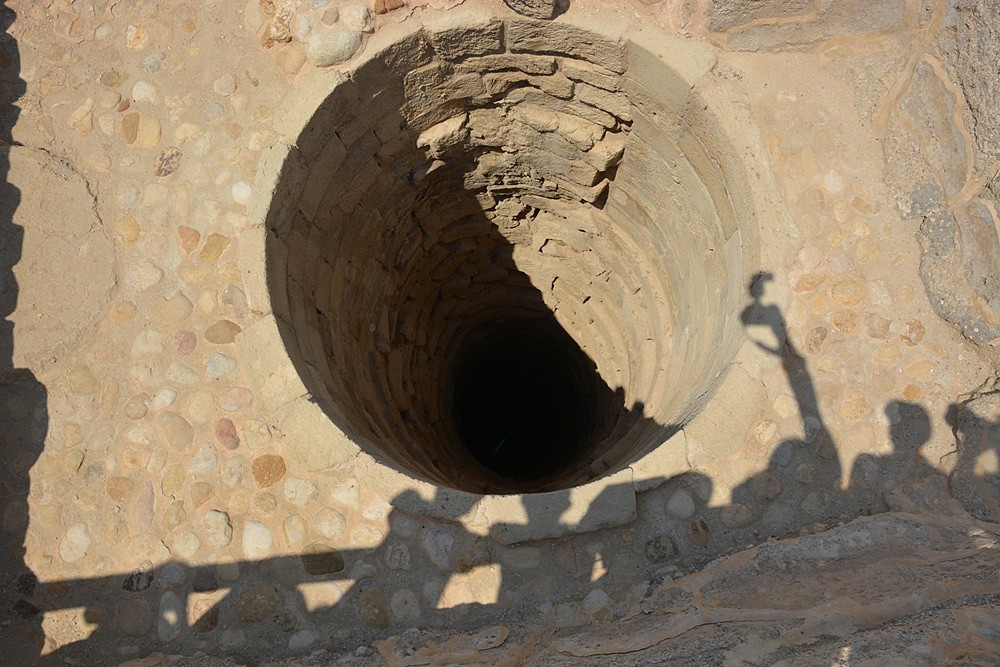 The well, a part of a complex water catchment system.