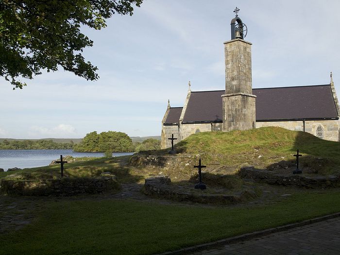 A chapel, the bell-tower and penitential beds on Station Island, Lough Derg, Donegal