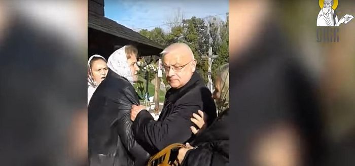 Uniate “Priest” Nikolai Medinsky pushing elderly women. The “chaplain” previously called for “death to the enemies”.