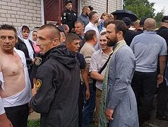 Ukrainian radicals beat priest, women in attempted church seizure