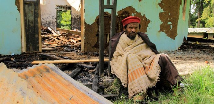 A member of the Ethiopian Tewahedo Church sits in front of the destroyed Doya St. Michael Church, Southern region, Sidama district, July 2019. Credit: Courtesy of Tewodrose Tirfe/Amahara Association of America