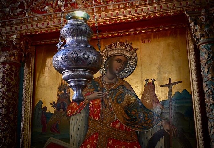 On the iconostasis of the Monastery basilica following Divine Liturgy on November 21, 2019, Saint Catherine contemplates the love with which the crucified Christ restores humanity to Himself