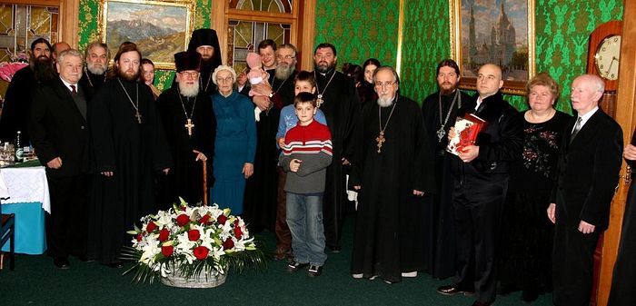 Fr. Matthew with family, loved ones, and friends. Then-Archimandrite Tikhon (Shevkunov), now Metropolitan of Pskov, stands on the right near the picture of Theophany Cathedral.