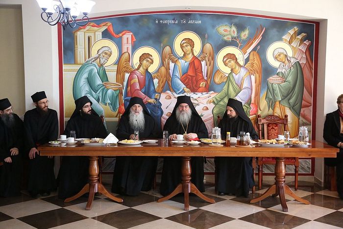 Metropolitan Athanasios, Abbot Paisios, Elder Zacharias, and brothers of the monastery at trapeza
