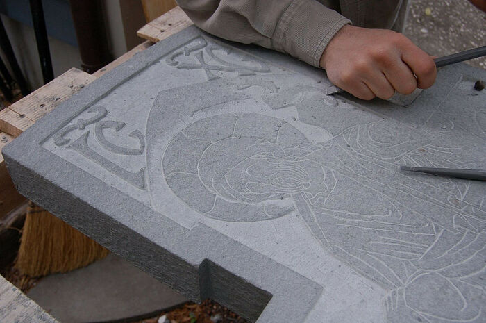 Jonathan Pageau carves the headstone.