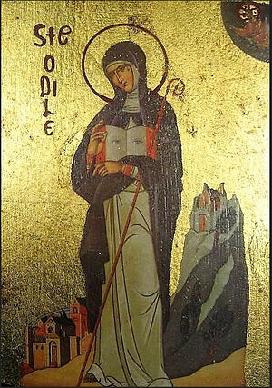 Современное православное изображение святой Одилии с открытыми глазами на страницах книги