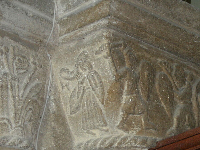 St. Cyneburgh as depicted on a capital of the church in Castor with two warriors pursuing her, Cambs (provided by Dr. Avril Lumley-Prior)