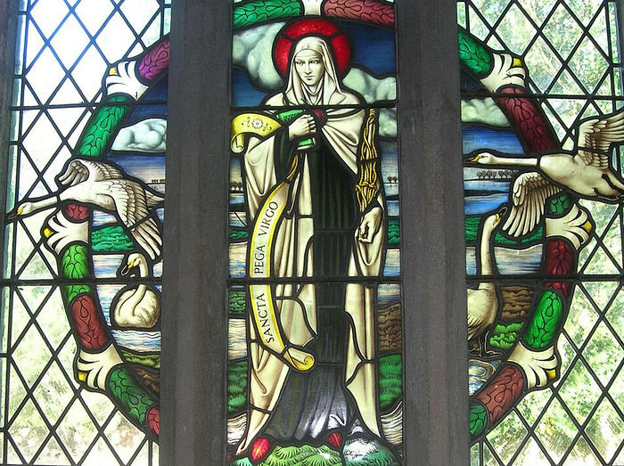 St. Pega depicted on a stained glass window of the north aisle of the church at Peakirk, Cambs (kindly provided by Dr. Avril Lumley-Prior)