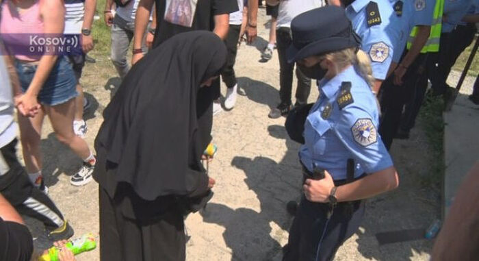A nun being searched