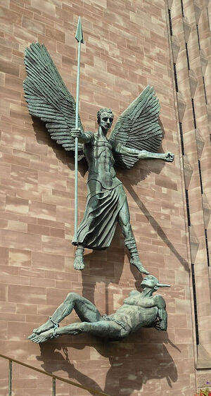 The sculpture of St. Michael vanquishing the devil on the wall of the new cathedral in Coventry. Photo by Irina Lapa