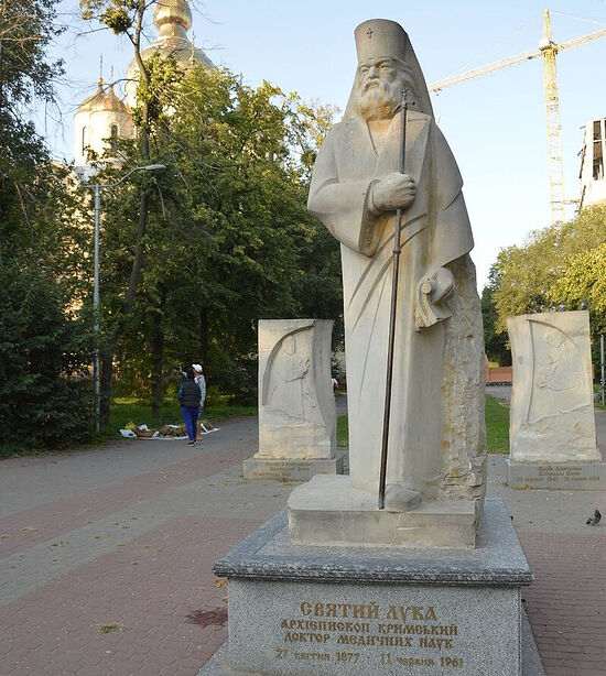 The sculpture of St. Luke of Crimea with bas-reliefs of his parents