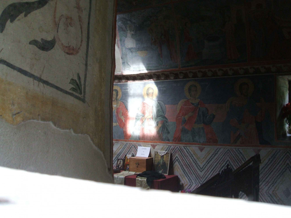 This photo was taken at Cherepish Monastery, north of Sofia. I love the way the light has cast a shadow of the window on the first row of saints.