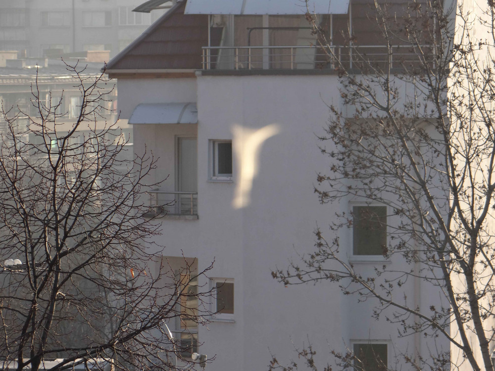 I tried many times to capture this cross, a reflection that appeared in the morning on a house in Sofia.
