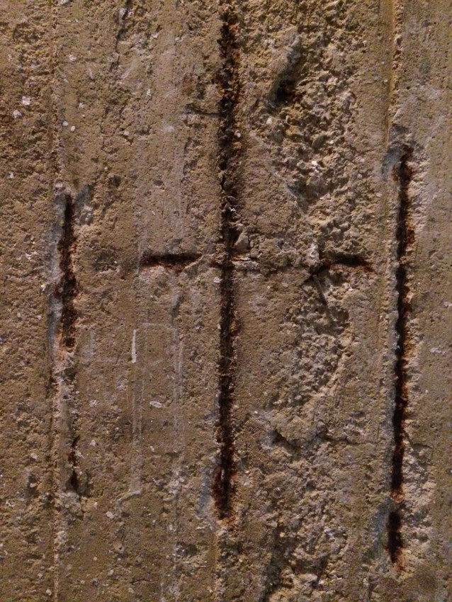 These girders in a basement in Metsovo, Greece, seem to represent Christ with the two thieves.