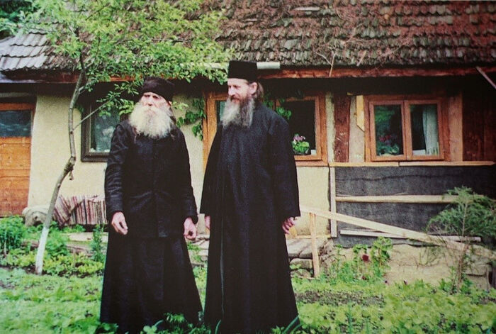 Elder Paisie with his spiritual child Archimandrite Ioanichie (Balan) in front of his cell at Sihla Skete