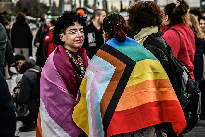 Supporters of the LGBTQ community gather Thursday outside the Greek Parliament as lawmakers vote on a same-sex marriage and same-sex couples adoption bill in Athens. Aris Messinis / AFP - Getty Images